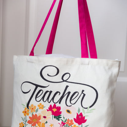 Tote bag with 'Teacher' text and floral design on a white background